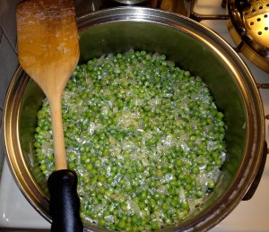 Add peas to sauteed onions