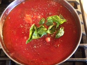 Here is the beautiful homemade tomato sauce simmering away.  I sprinkled some oregano and added some fresh basil leaves from my yard.