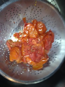 After you mill the first group of tomatoes, you need to scrape up what is left in the food mill and place it into a colander or dish. This "leftover" is referred to as pomace. It is used in the food industry as "vegetables", yes check your labels, even in dog food.